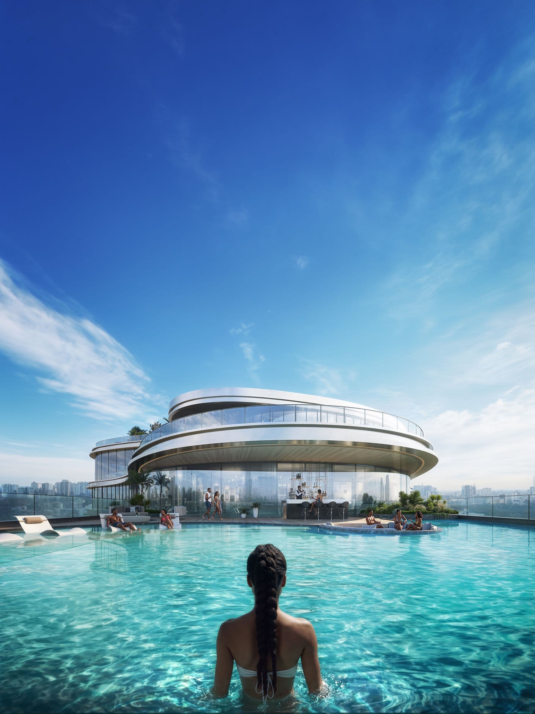 A swimmer in the infinity pool looking towards the bar